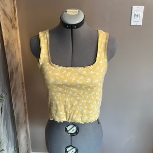 This cute yellow floral thank top from Forever 21 is a size medium!